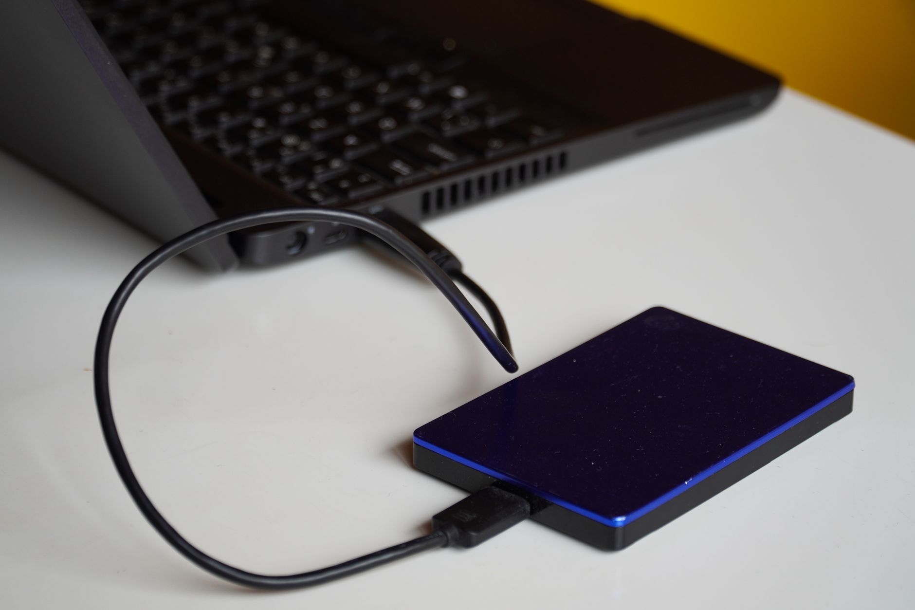An external drive connected to a laptop, the local copy that should back up any lifetime cloud plan