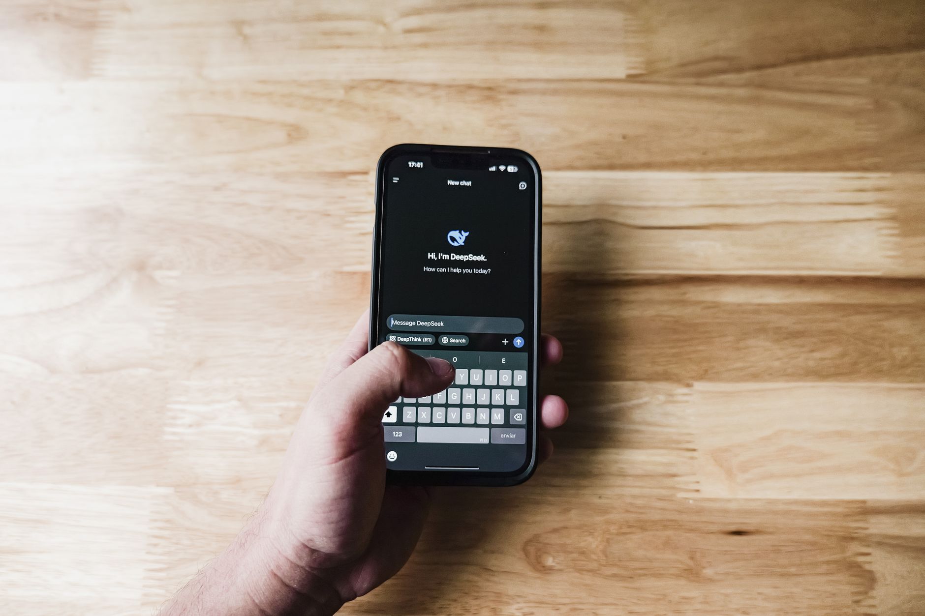 A person using an AI assistant on a phone at home, the everyday use Magai lifetime buyers signed up for